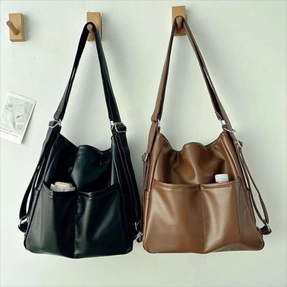 Draagbare grote capaciteit retro woon-werkverkeer rugzak effen kleur handtas reizen schoudertas eenvoudige casual crossbody tas unisex