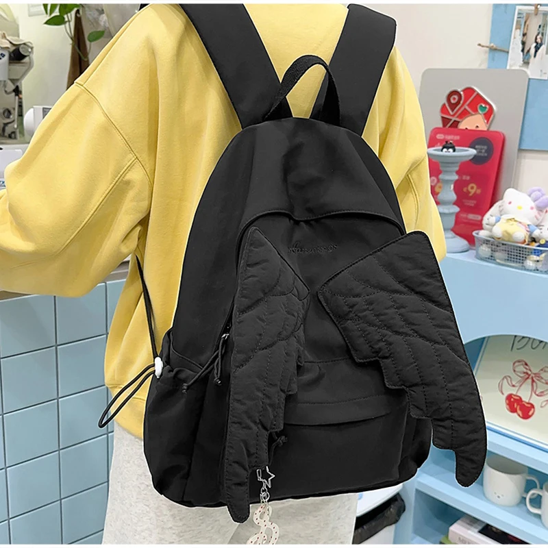 Mochila con alas estilo Y2k para mujer, bolso de lona con bonito Ángel japonés, bolso de hombro de gran capacidad con borlas creativas de Color sólido para estudiantes