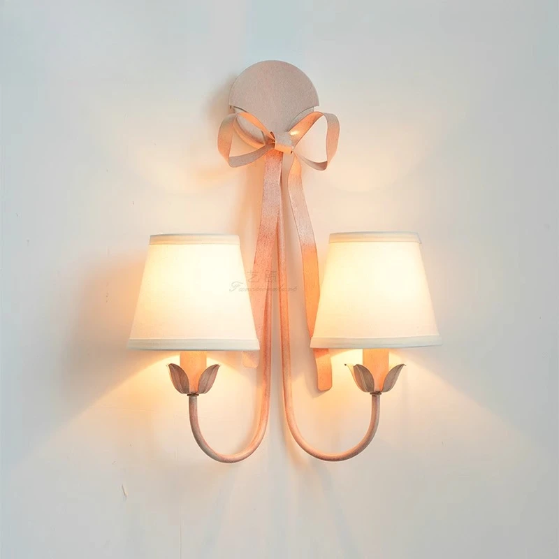 

Nordic princess room wall lamp creative wrought iron pink bow background wall lamp girl room bedroom bedside lamp