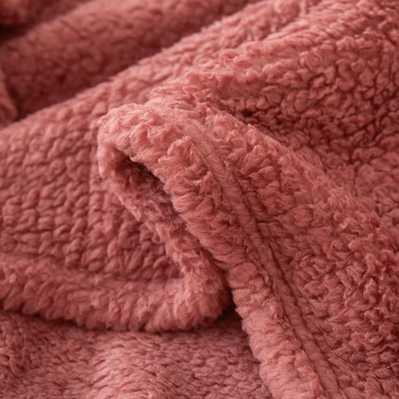 Embrace of Softness: Solid Color Coral Fleece Throw. Your All-Season Snuggle Companion for Couch & Bedside Comfort.