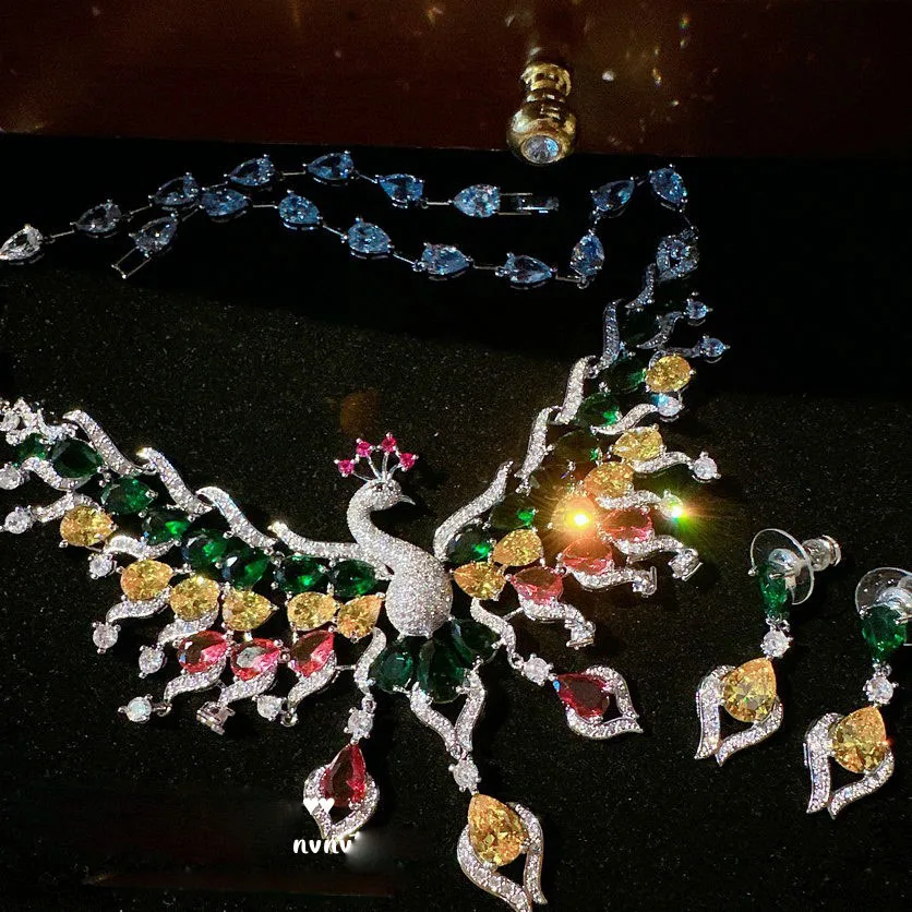 

2023 Women Beautiful Rainbow Peacock Gem Wing Necklace Plated with 18K Gradient Zircon Phoenix Set