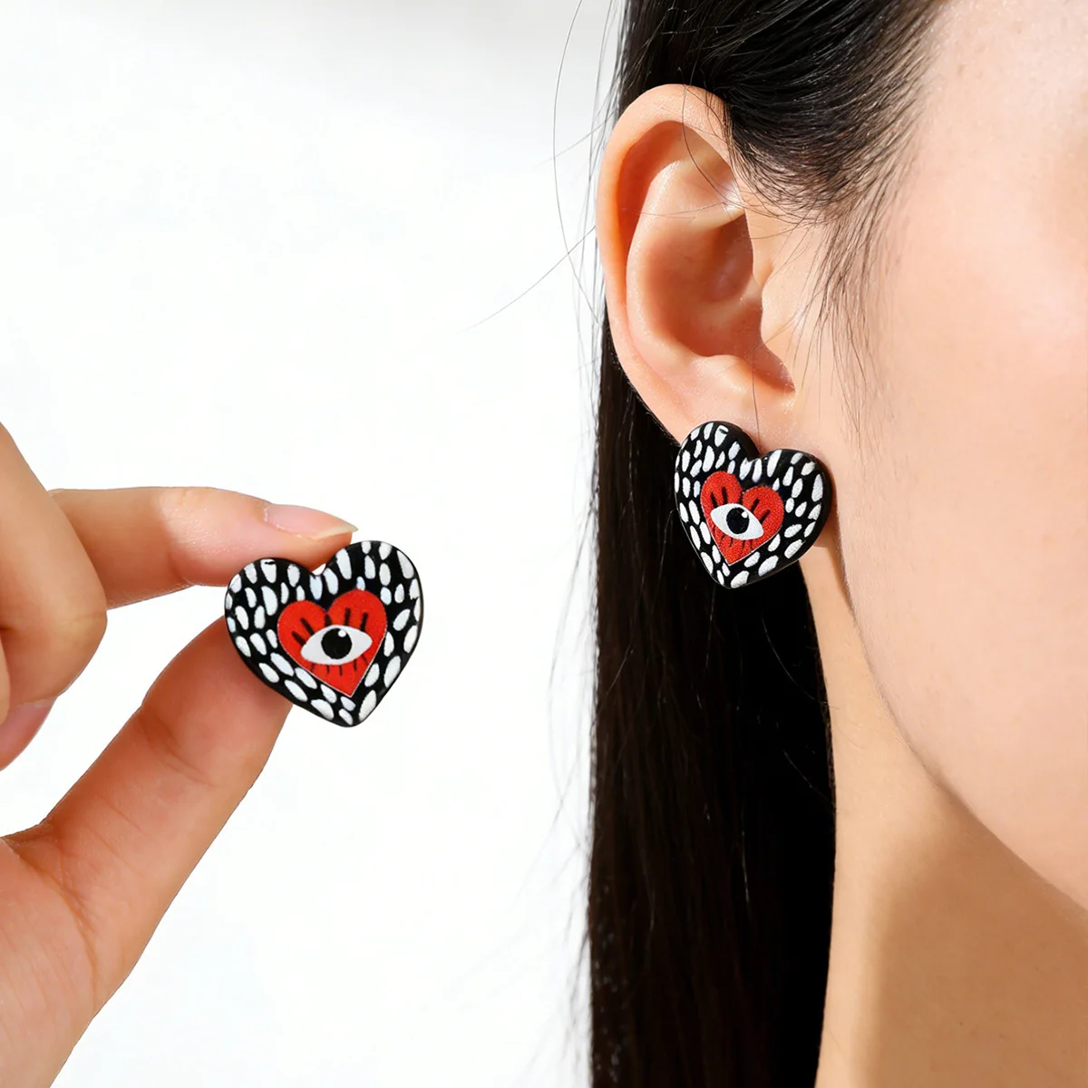 Cross-border devil's eye, niche design, heart-shaped eye stud earrings, colorful graffiti, funny ear jewelry trend