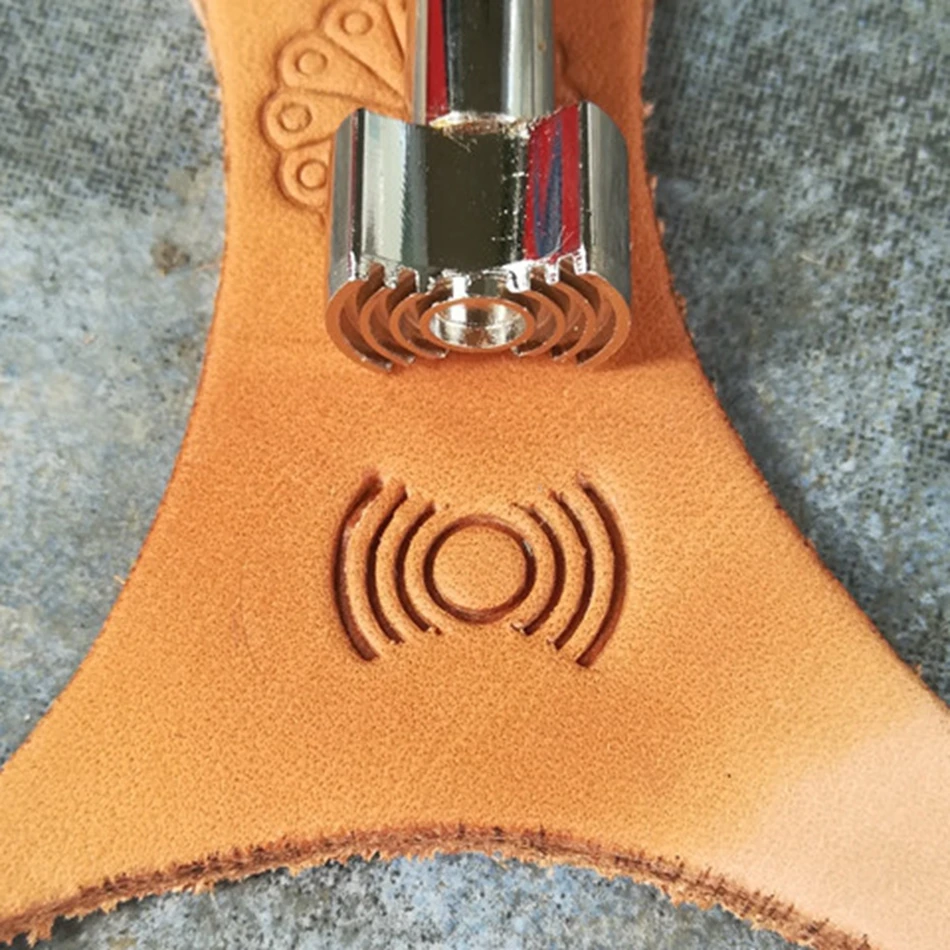 Leathercraft tools and hardware, precision steel engraving and embossing tools, electric wave patterns for decorative motifs.