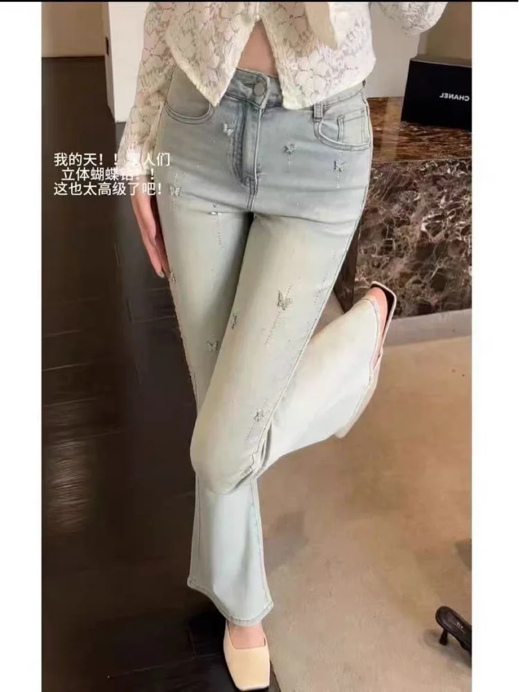 Style européen léger luxe lourd embelli diamant 2025 automne hiver taille haute jean évasé pour les femmes ajustement élastique pantalons longs