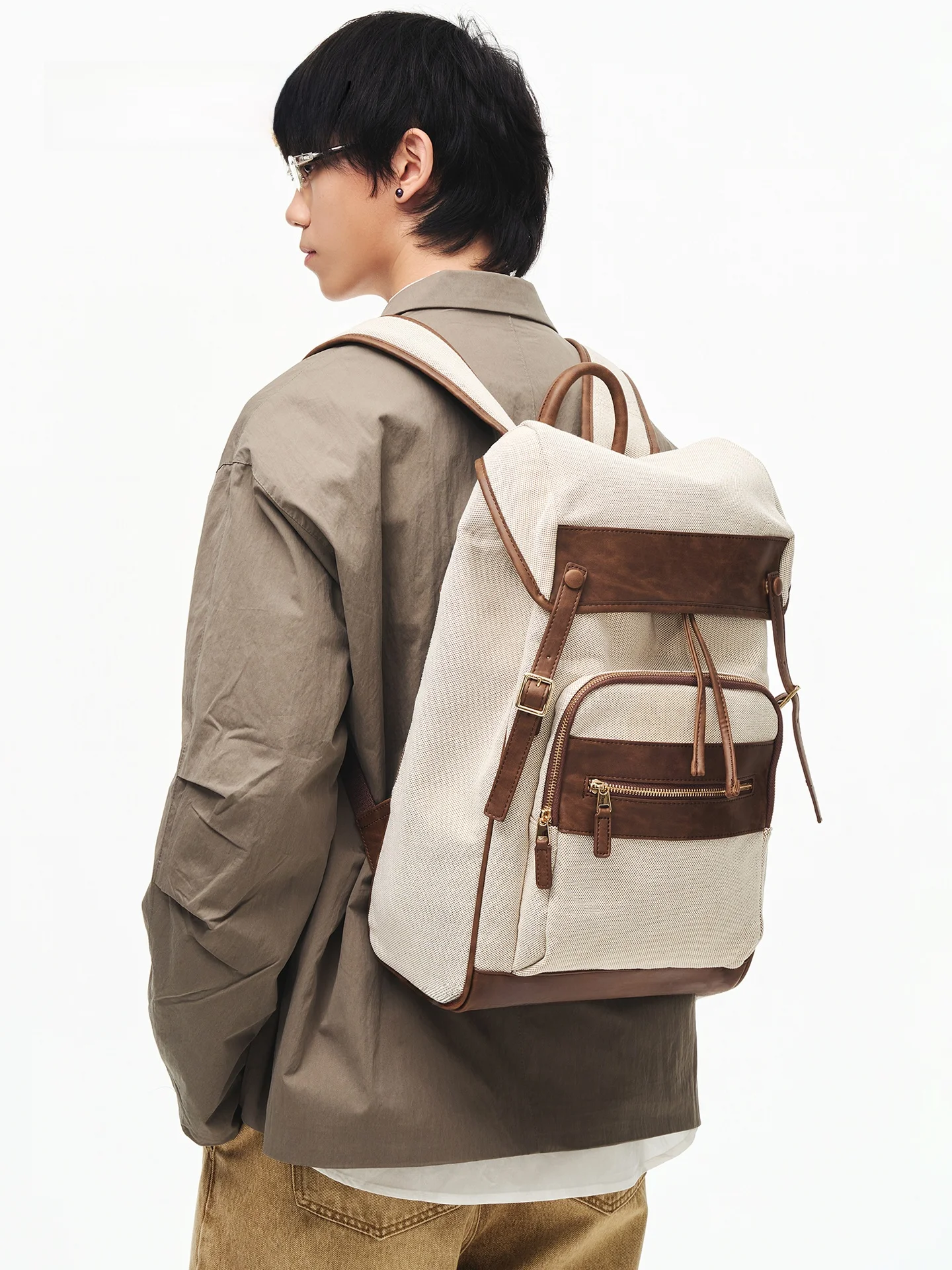 

Nesbit Retro British Style Men's Large Capacity Canvas Leather Patchwork Drawstring Backpack School Bag Double Shoulder Bag