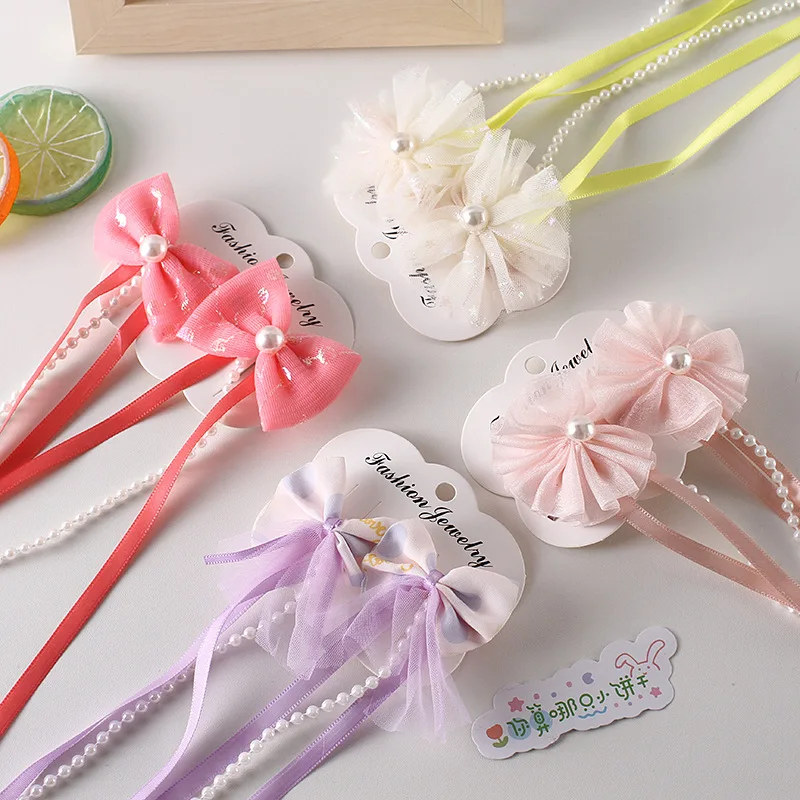 2023 New children's bowknot hairpin girls' hair braid headdress antique pearl tassel clip streamer Hanfu hairpin for women