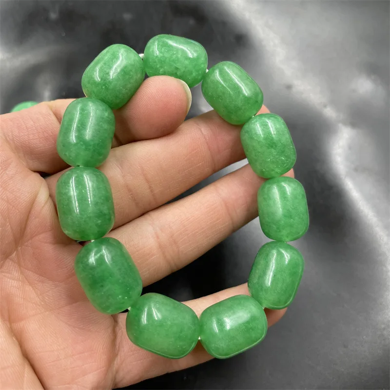 White background with tube beads , emerald green 20mm jadeite bracelet
