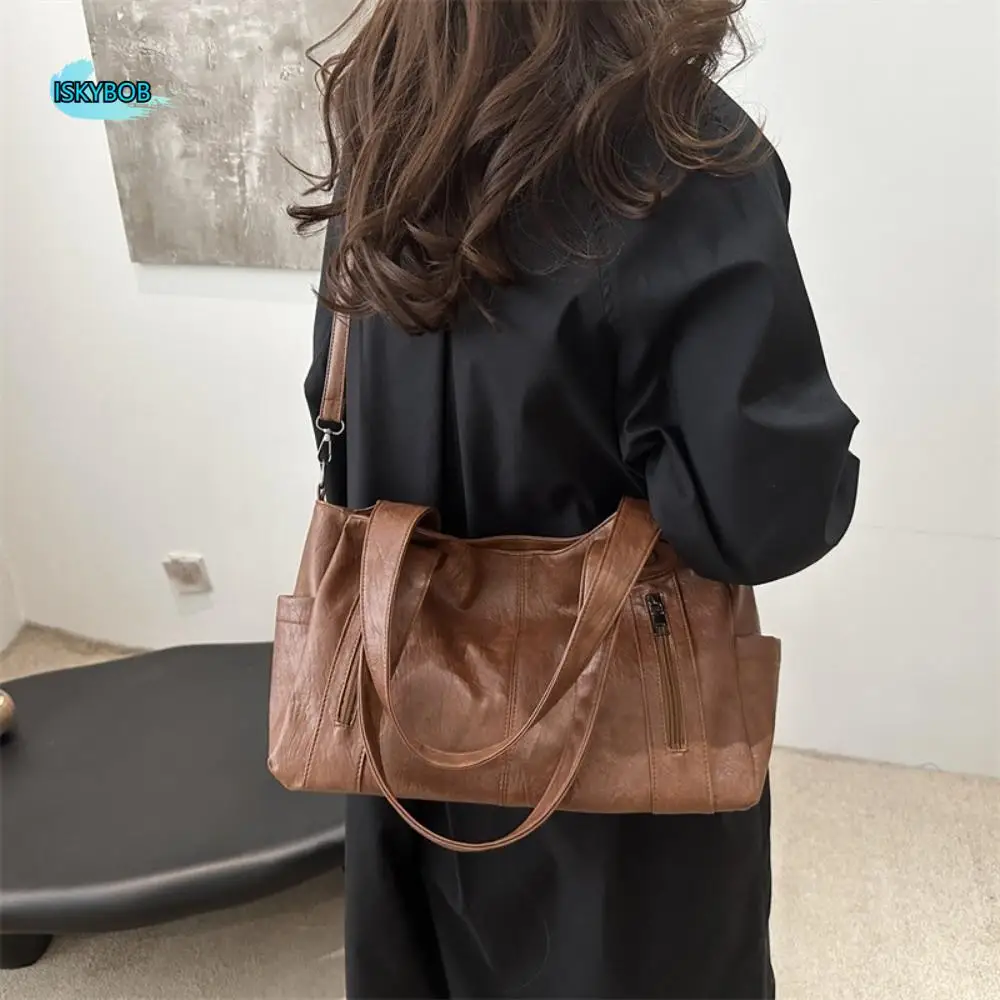 

Casual Retro PU Shoulder Bag Large Capacity Locomotive Style Commuting Handbag Waterproof Solid Color Underarm Tote Bag Travel