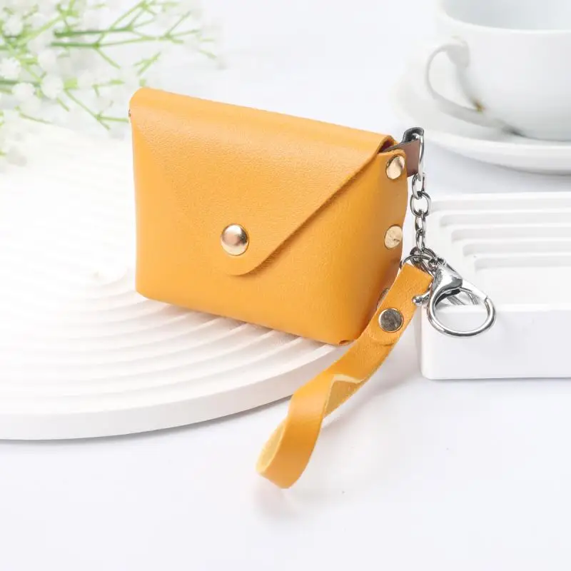 Mini portamonete alla moda Semplice portamonete portatile in pelle PU Borsa portaoggetti per cuffie Portafoglio piccolo con cinturino da polso per donna uomo