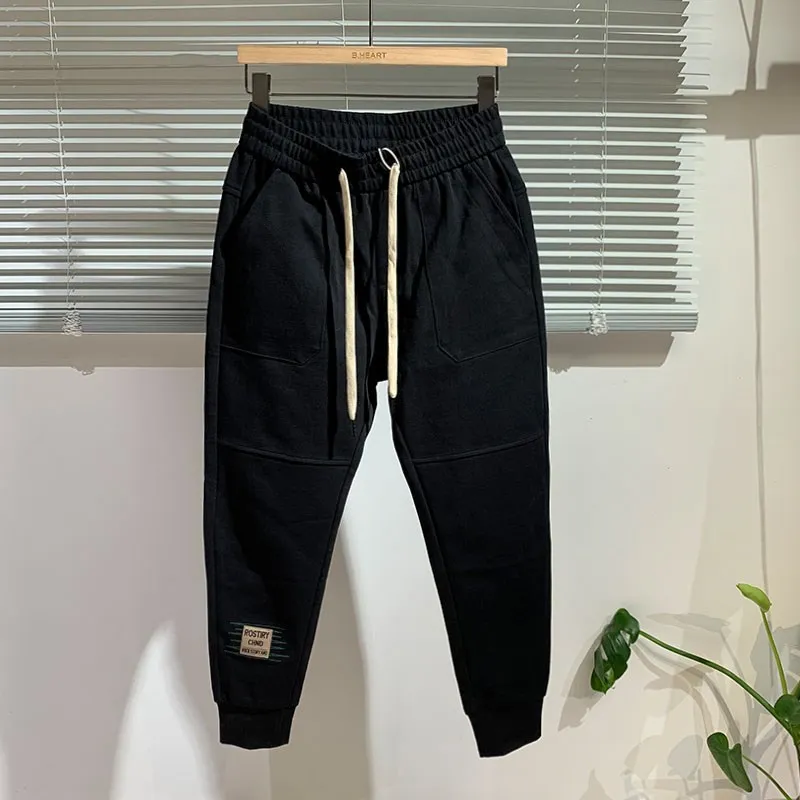 

Мужские трикотажные спортивные брюки, повседневные длинные брюки с эластичной резинкой на талии, модные универсальные облегающие молодежные брюки, подходящие для всех сезонов