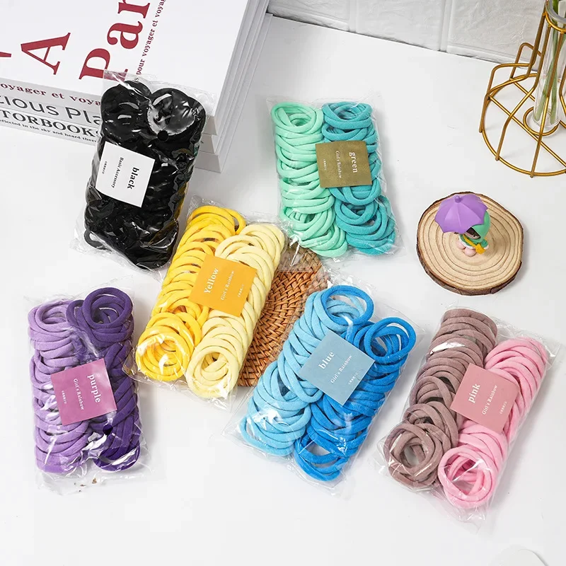 

Набор из 50 предметов двухцветной четырехсезонной высокоэластичной бесшовной веревки для волос, простой и прочный, модный, мягкий кожаный ремешок