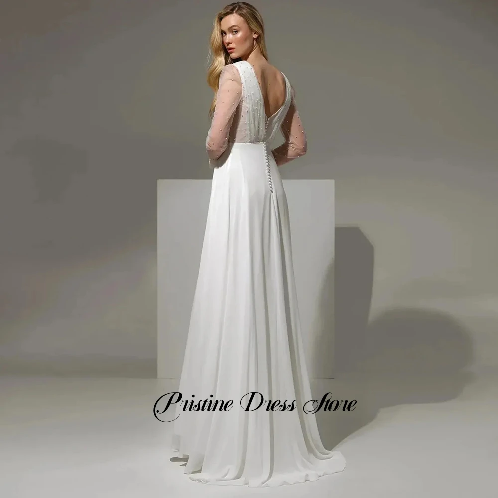 فستان زفاف رومانسي من الشيفون واللؤلؤ بأكمام طويلة مخصص بطيات عميقة على شكل حرف v بطول الأرض مع مشد