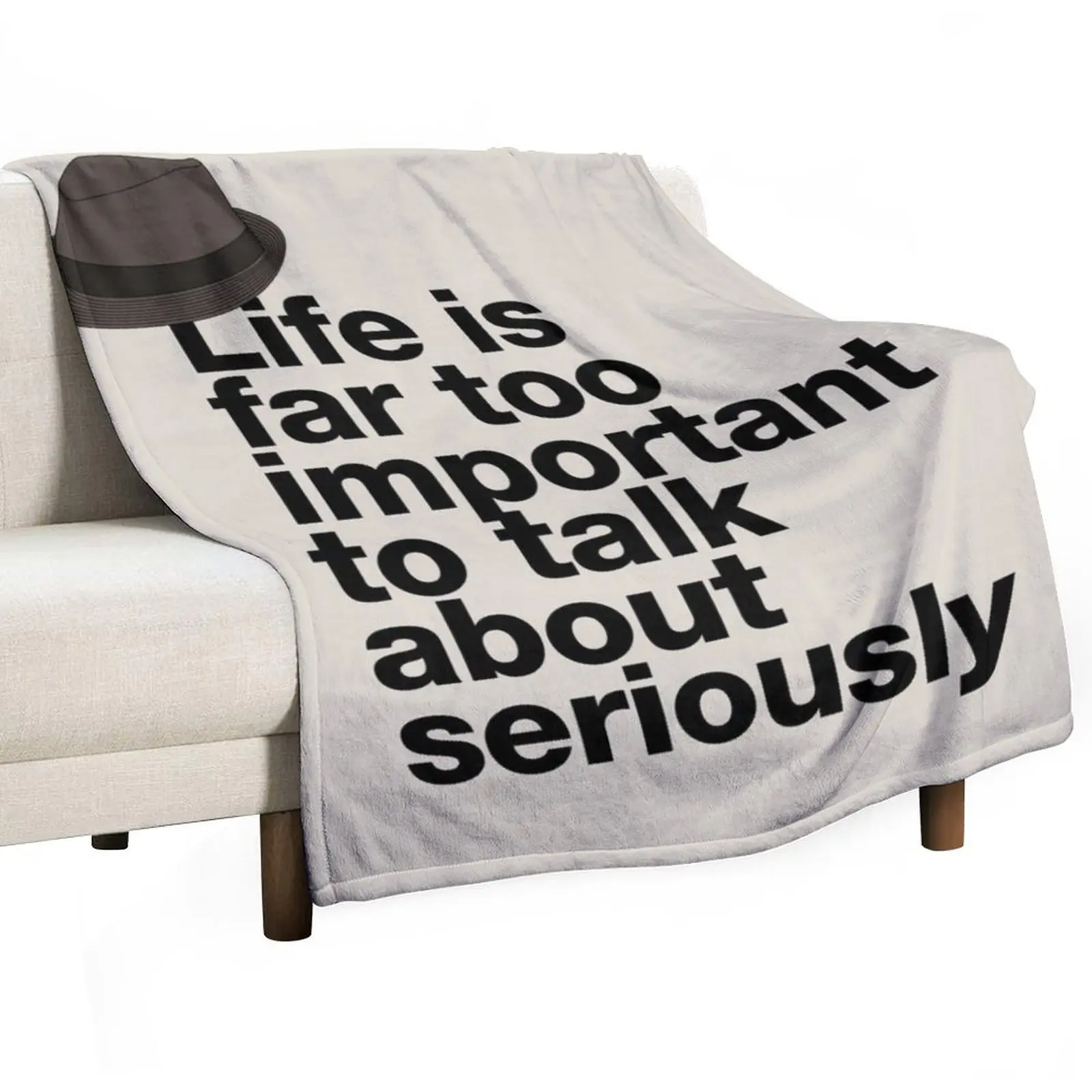 

If in doubt quote Raymond Reddington: "Life is far too important to talk about seriously" quote with Fedora hat Throw Blanket