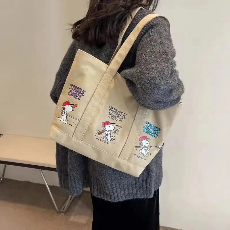 Nuevo bolso de lona portátil de un solo hombro de gran capacidad informal y versátil con estampado de dibujos animados personalizados para mujer Snoopy