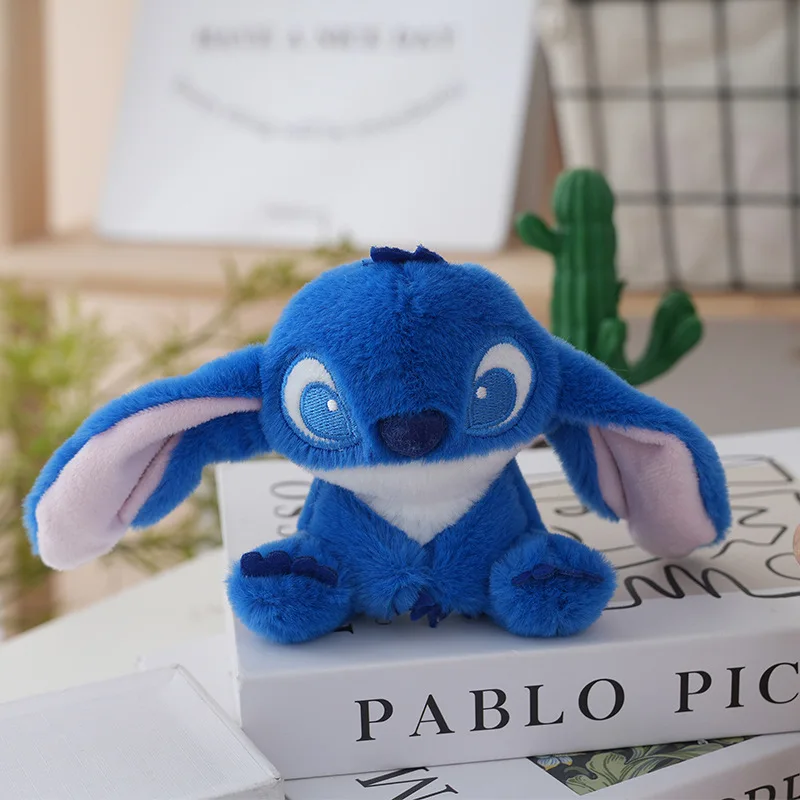 Lindo y encantador Stussy juguete de peluche llave llavero de peluche extraño juguete de peluche mochila colgante