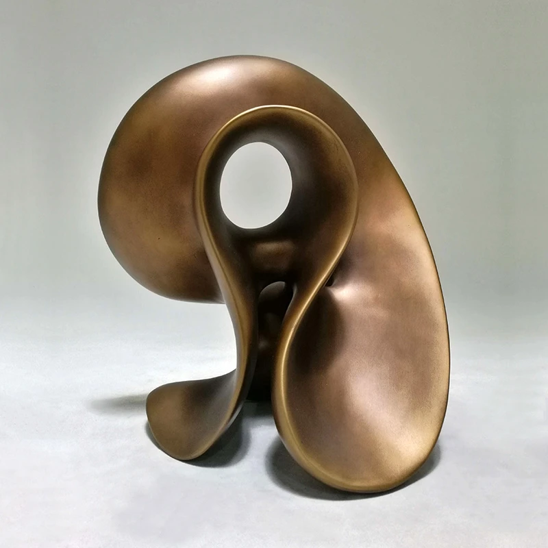 Hotel, model home, living room decor. Modern simple abstract art sculpture.