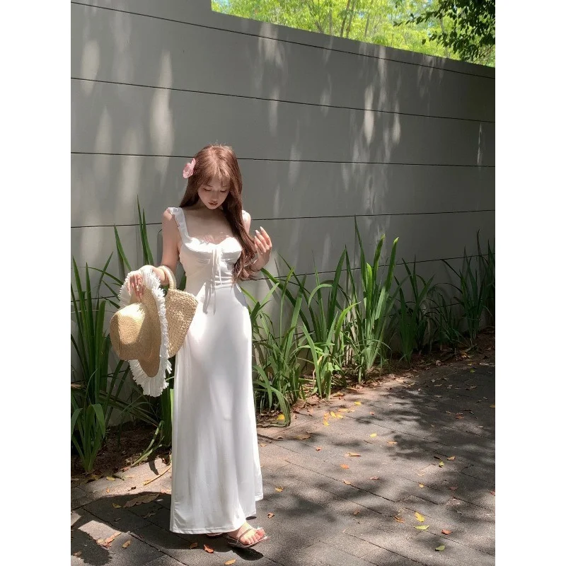 

Fairy style white suspender backless dress for children summer 2024 new seaside vacation temperament beautiful long dress