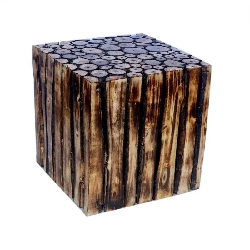 Country wood square stools or side tables with charred wood veneer and natural log slices for eco-friendly home