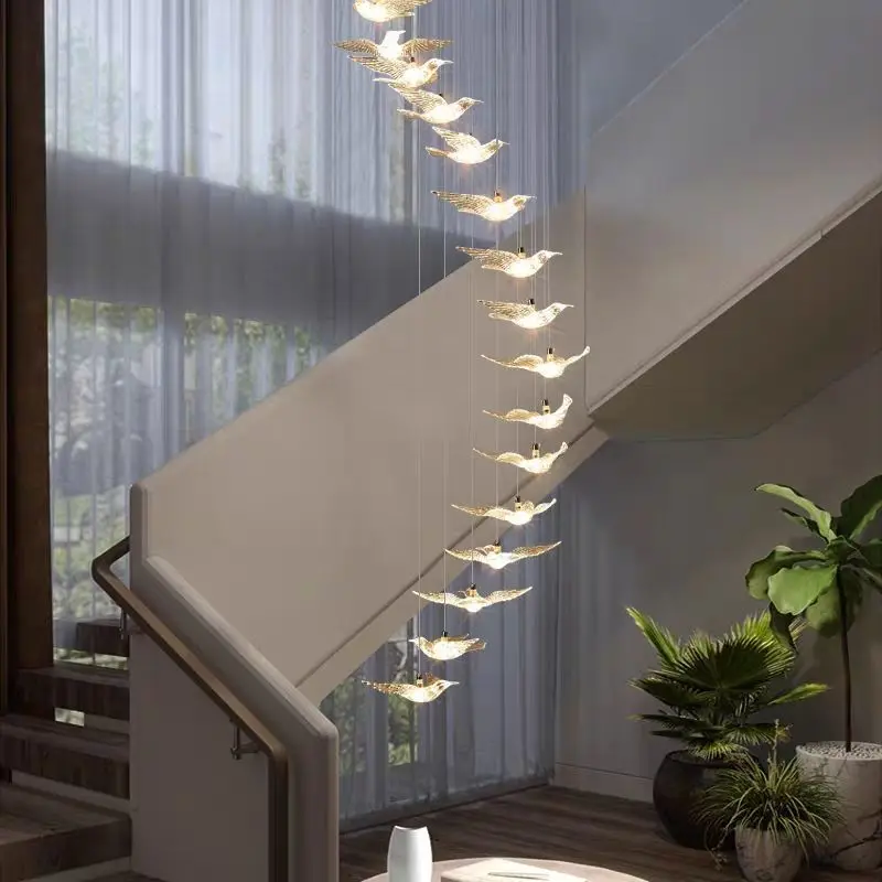 The stairwell is modern, simple and atmospheric, with an adjustable and rotating duplex chandelier