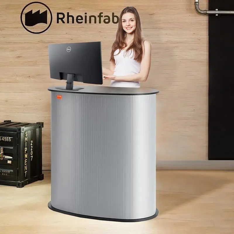 Comptoir de stand pour foires et salons, dimensions 900 × 490 × 940 mm. Comptoir d’exposition pop-up pliable avec paroi arrière et espace de rangement intérieur. Support stable pour les promotions commerciales, livré avec sac de transport 29,48 kg.