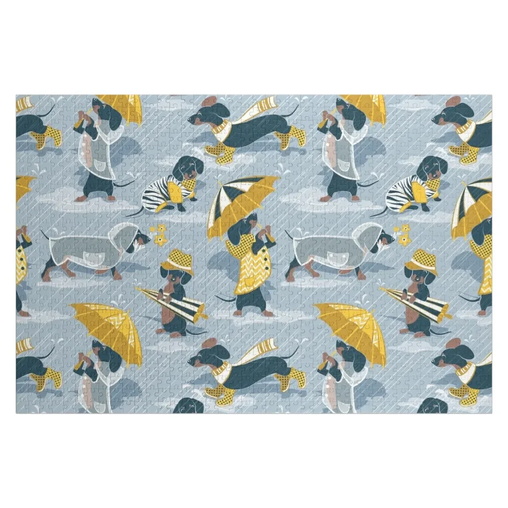 Ready For a Rainy Walk // pastel blue background dachshunds dogs with yellow and transparent rain coats Jigsaw Puzzle