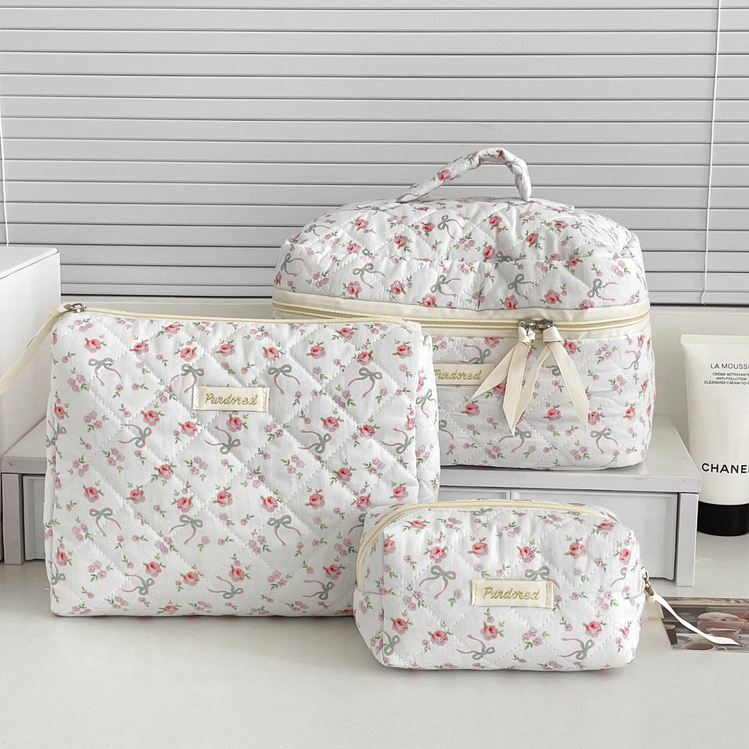 Three-piece bow floral quilted makeup bag set in multiple sizes
