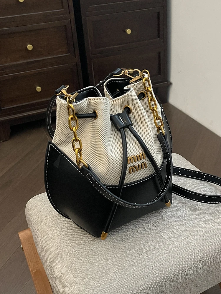 

Light luxury designer commuter drawstring underarm bag bucket bag female 2025 high-end canvas chain bag shoulder messenger bag