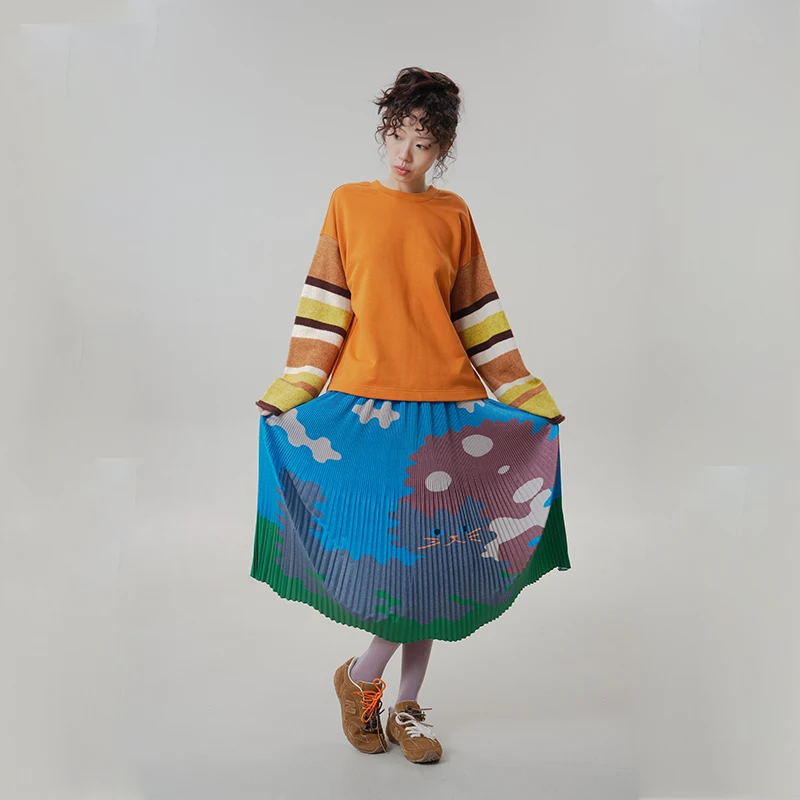 MOVEUP Women's Pleated Midi Skirt 2026 Autumn Elastic Waist Cartoon Cat Print Wave Hem Vacation Style A-line Skirt 3ELQ20604