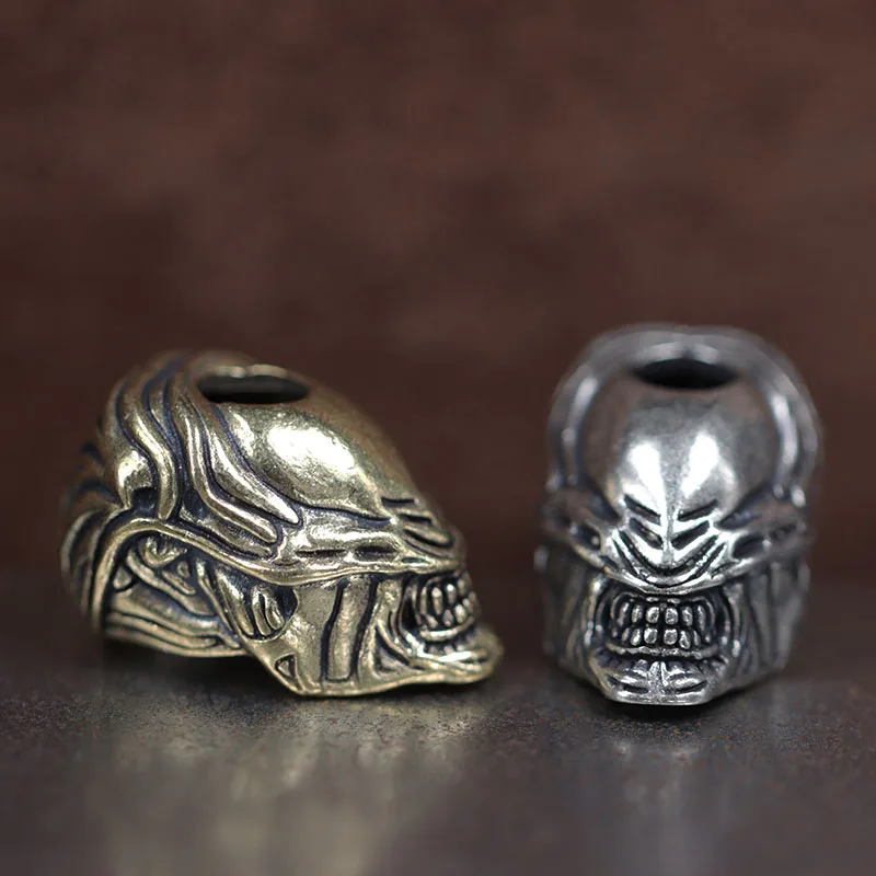 

Alien Beast Face Warrior Brass Knife Bead EDC DIY Paracord Woven Bracelets Lanyard Pendants Accessories Outdoor Hangings Charms