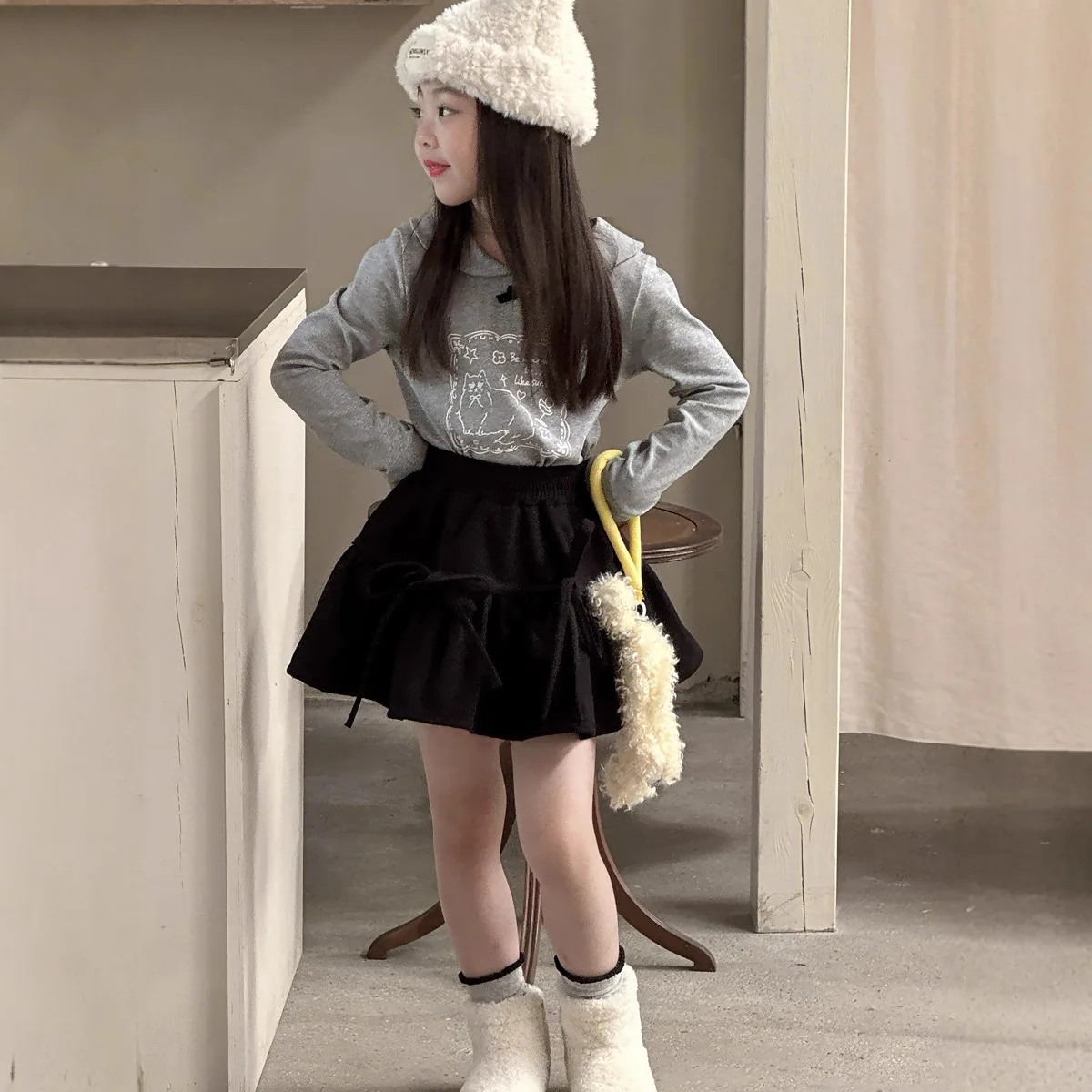 الفتيات الخريف والشتاء النسخة الكورية الجديدة من مرحة القوس حزام تنورة صوفية كلمة تنورة قصيرة أزياء عارضة