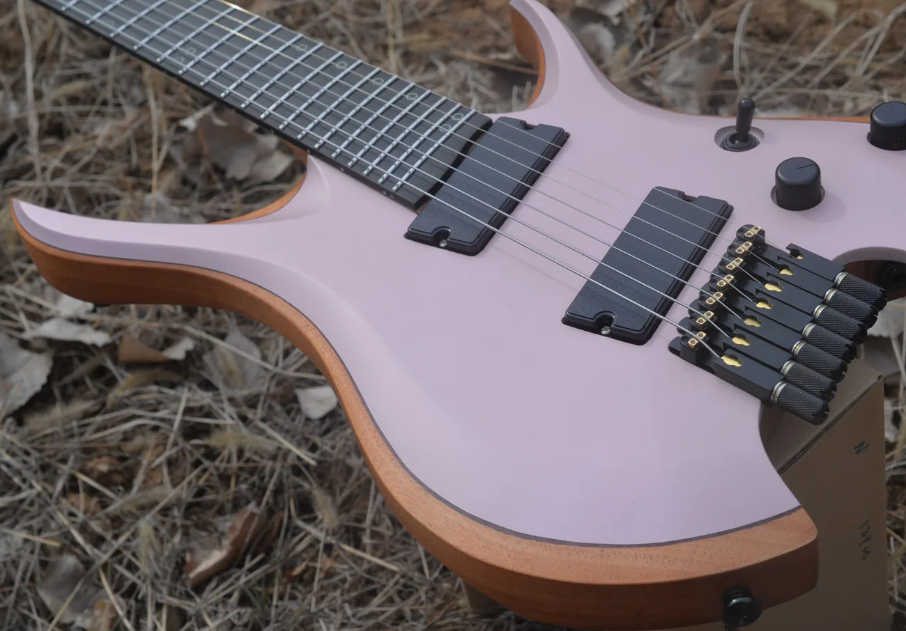 2024 Fanned frets 7 Strings Headless Electric Guitar Pink color 5-ply Roasted Maple Neck Ergonomic Ebony MAHOGANY