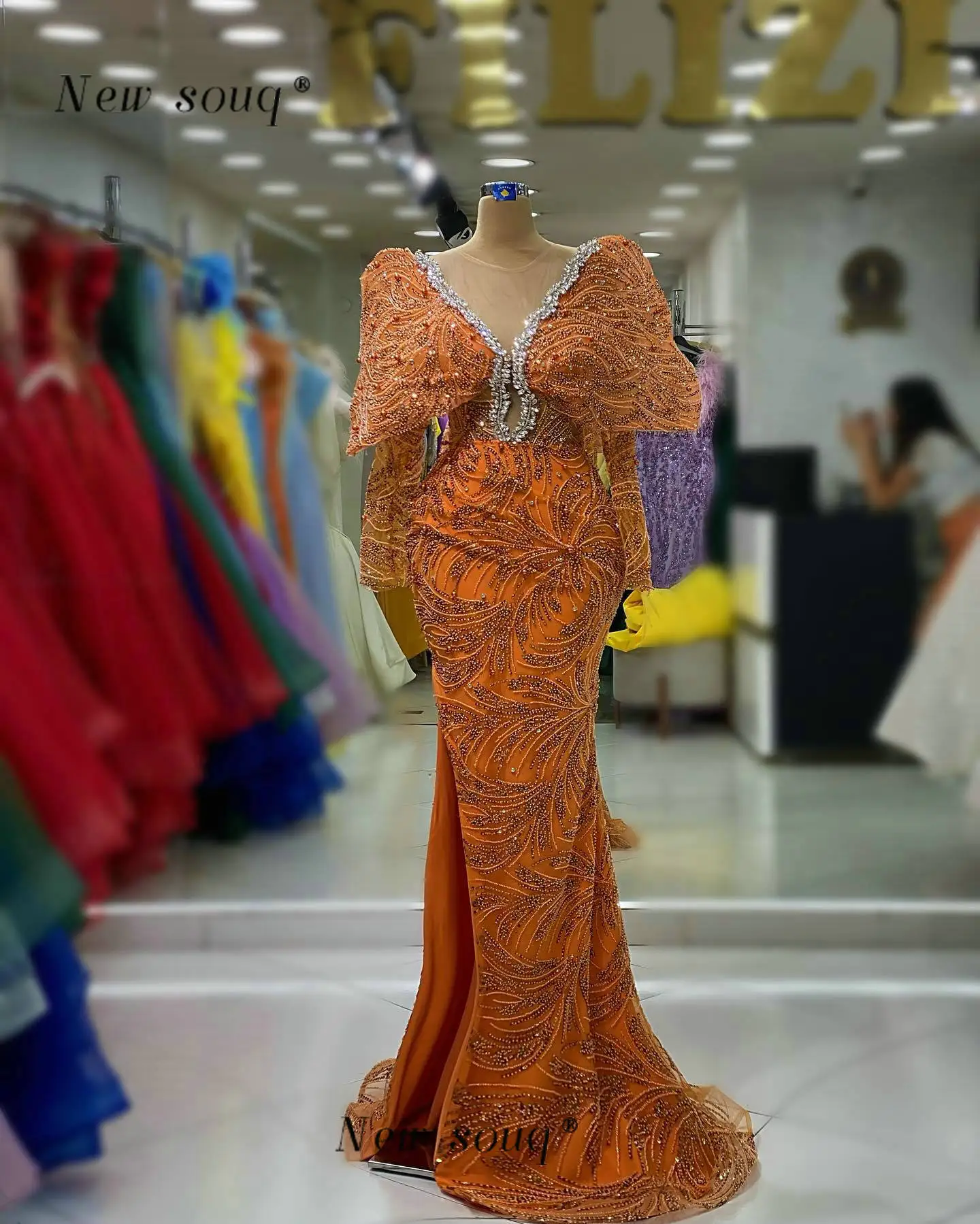 2023 Newest Orange Long Sleeves Mermaid Evening Dresses with Side Slit Sparkly Crystals Around Neck Dubai Formal Occasion Gowns