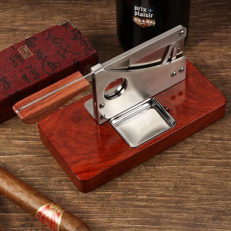 

Многофункциональный резак для сигар с двойным лезвием, V-образной формы, с основанием из нержавеющей стали и нескользящим покрытием, из массива дерева, с большим калибром.