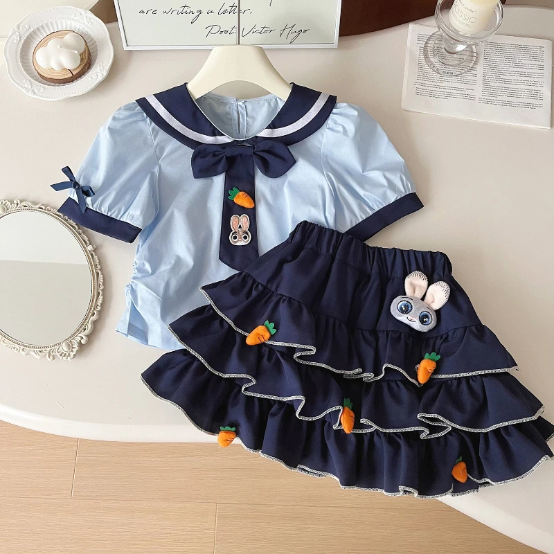 

Girls' Short Skirt Set Summer New Girls' Rabbit Carrot Decal Cute Navy Collar Top + Cake Skirt Two-piece Set