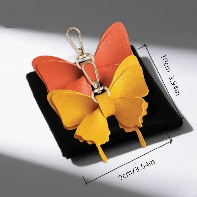 Schmetterlings-Schlüsselanhänger aus PU-Leder mit leuchtenden Farben und robustem Metallverschluss, perfekt zum Dekorieren von Rucksäcken und Handtaschen. – Detail 7