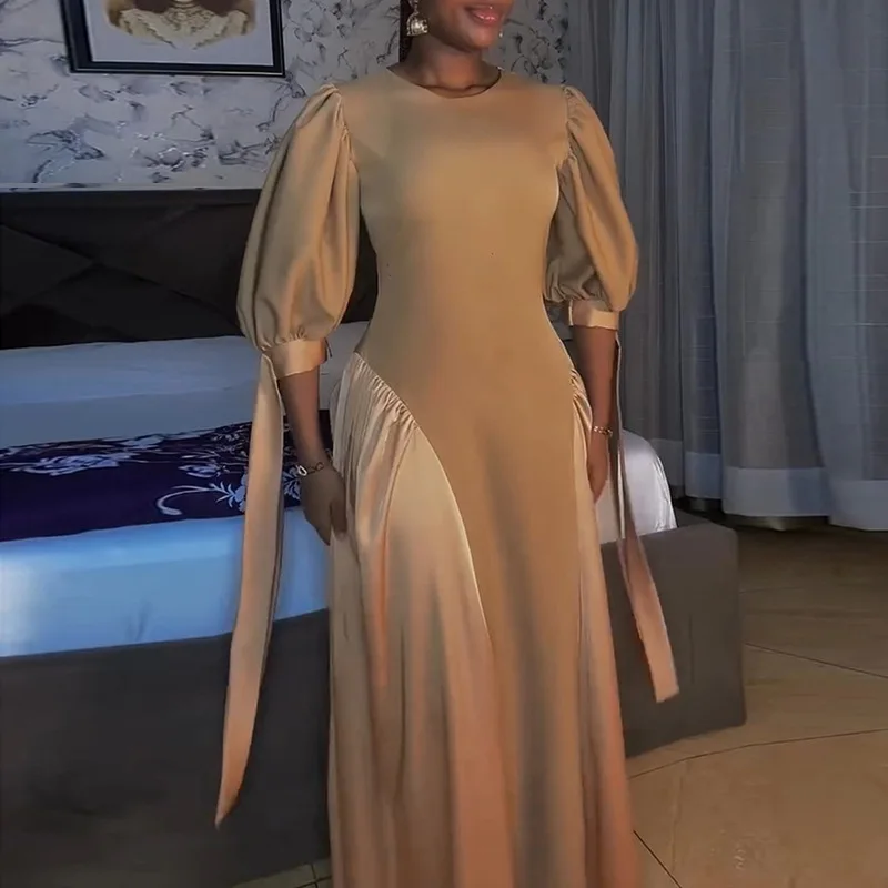 

New temperament elegant bubble sleeve medium and long dress fashionable simple versatile holiday style high-end dress