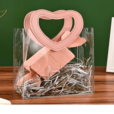 Sac cadeau rose avec poignées en forme de cœur, sac d'emballage cadeau en plastique Transparent réutilisable, fête nuptiale, sac cadeau de fête des mères 1 pièce