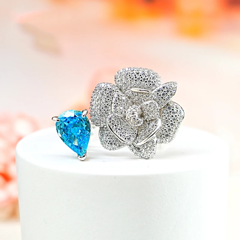 

Fashion Jewelry S925 Sterling Silver Spring New Camellia Ring 925 Silver Inlaid 7 * 10 Sea Blue Ice Flower Cut Ring