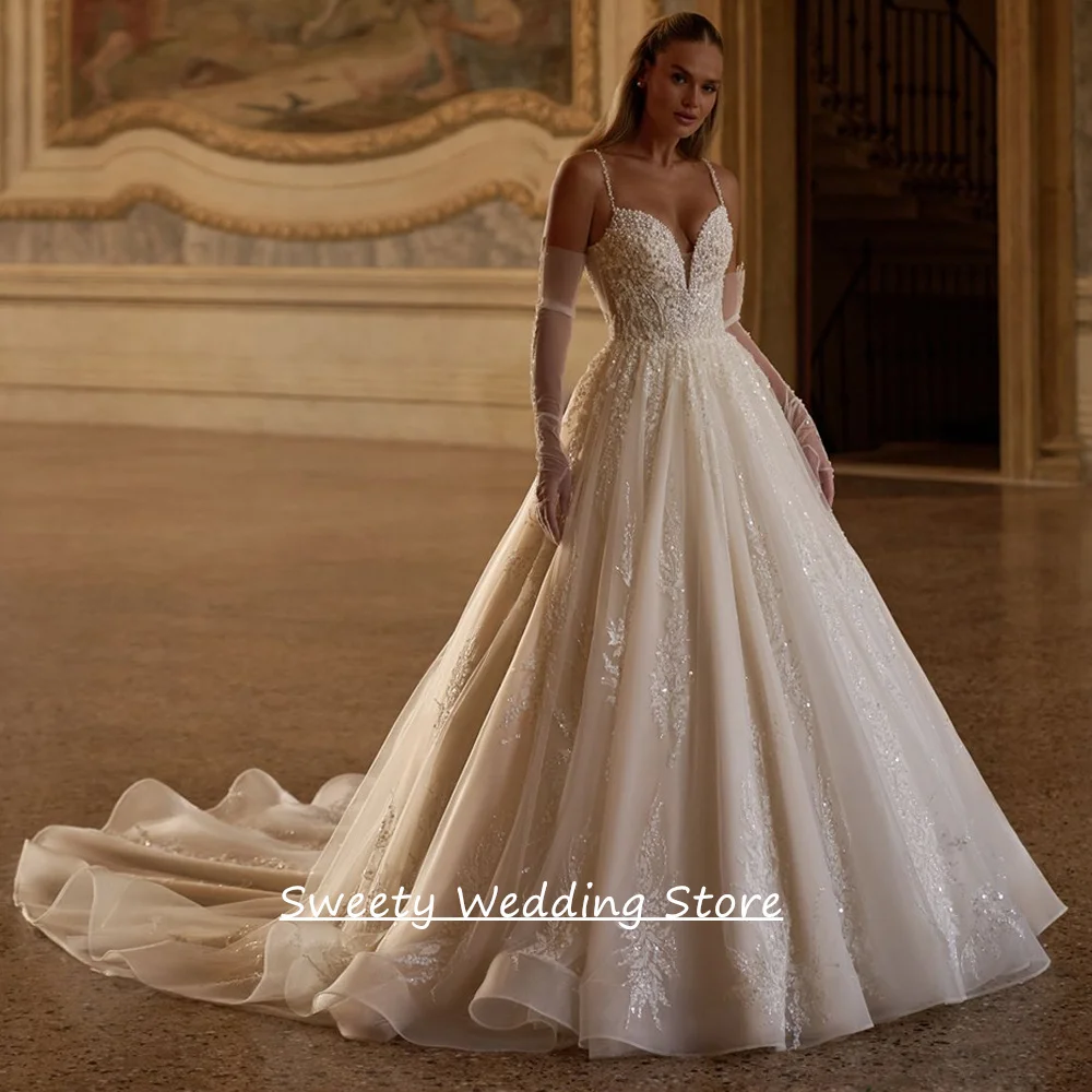 

Luxury Ball Gown Wedding Dress Customized Spaghetti Straps V Neck Beading Sequined Applique See Through Bridal Dresses