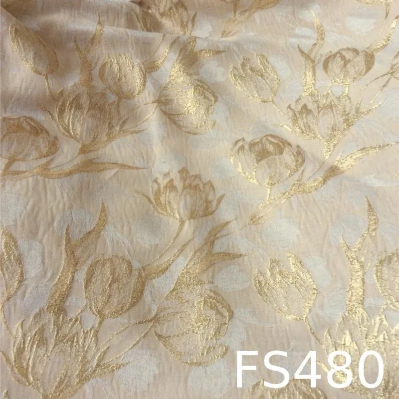 This is a women's dress fabric with and delicate featuring golden thread jacquard patterns color woven flower bud drape