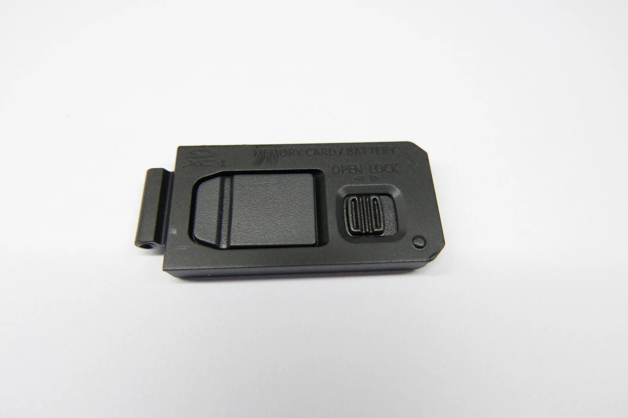 Per Panasonic Lumix DMC-LX100 Parte di riparazione del coperchio della serratura del coperchio dello sportello della batteria (nero)