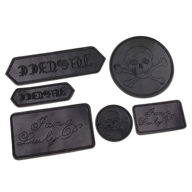 Cosa sono i con cocchi e perché questo patch in finta pelle con osso crociato è la scelta perfetta per chi cerca un tocco dark autentico?