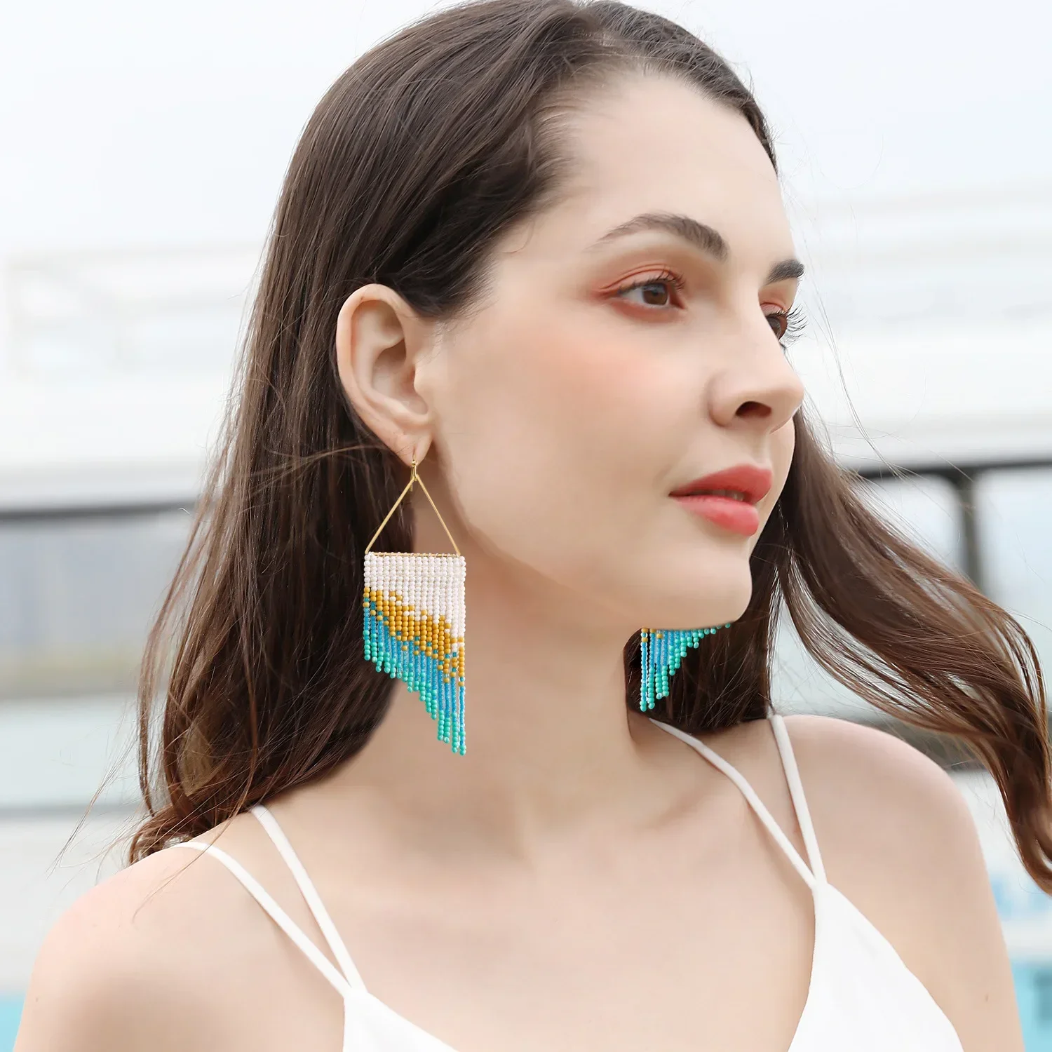 

Beaded earrings Tassel Female Gradient color Triangle Versatile Symmetry Hand knitting Bohemia Alloy Tide Rice bead earrings