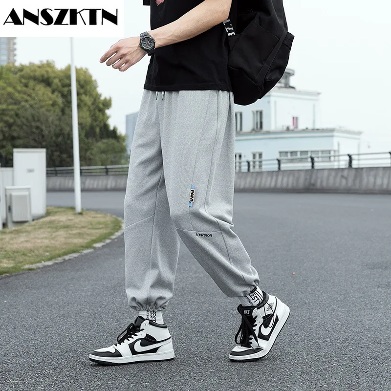 

ANSZKTN Autumn casual pants, men's running pants, sports pants with closed mouth and tied feet, loose Korean nine-point pants