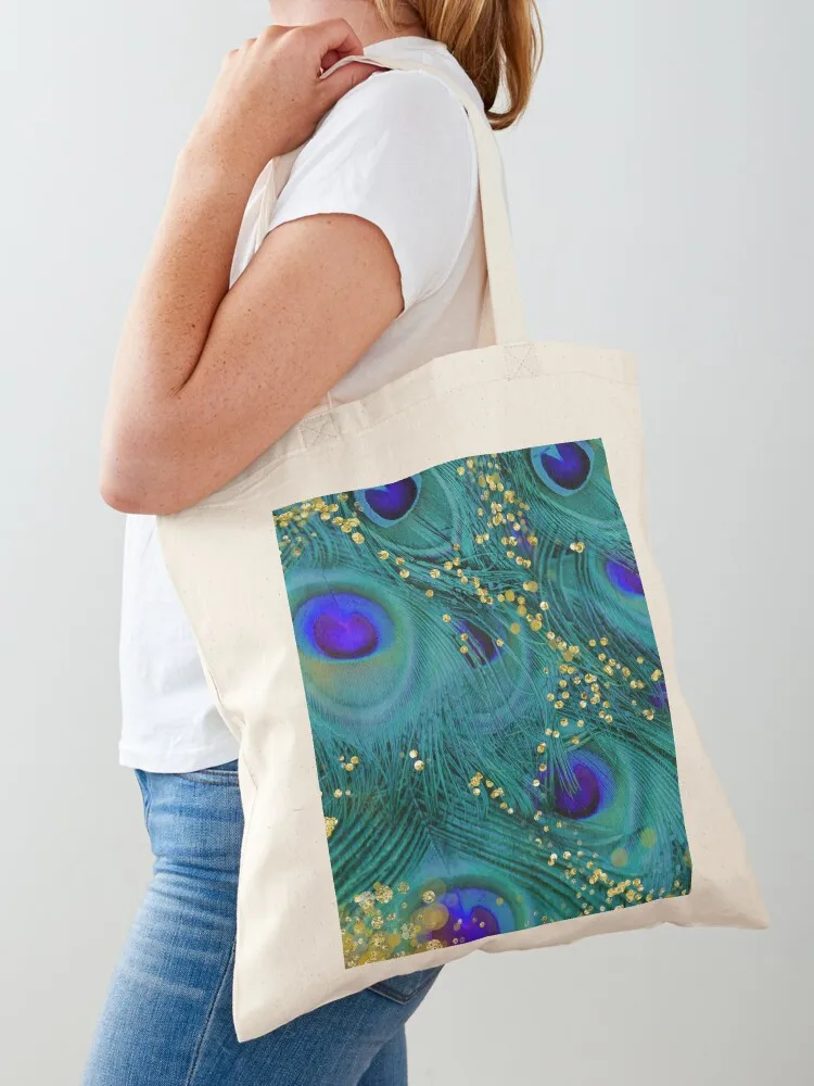 Bolso tote de lona con plumas de pavo real de ensueño, color verde azulado y morado, con detalles dorados brillantes, plegable y reutilizable.