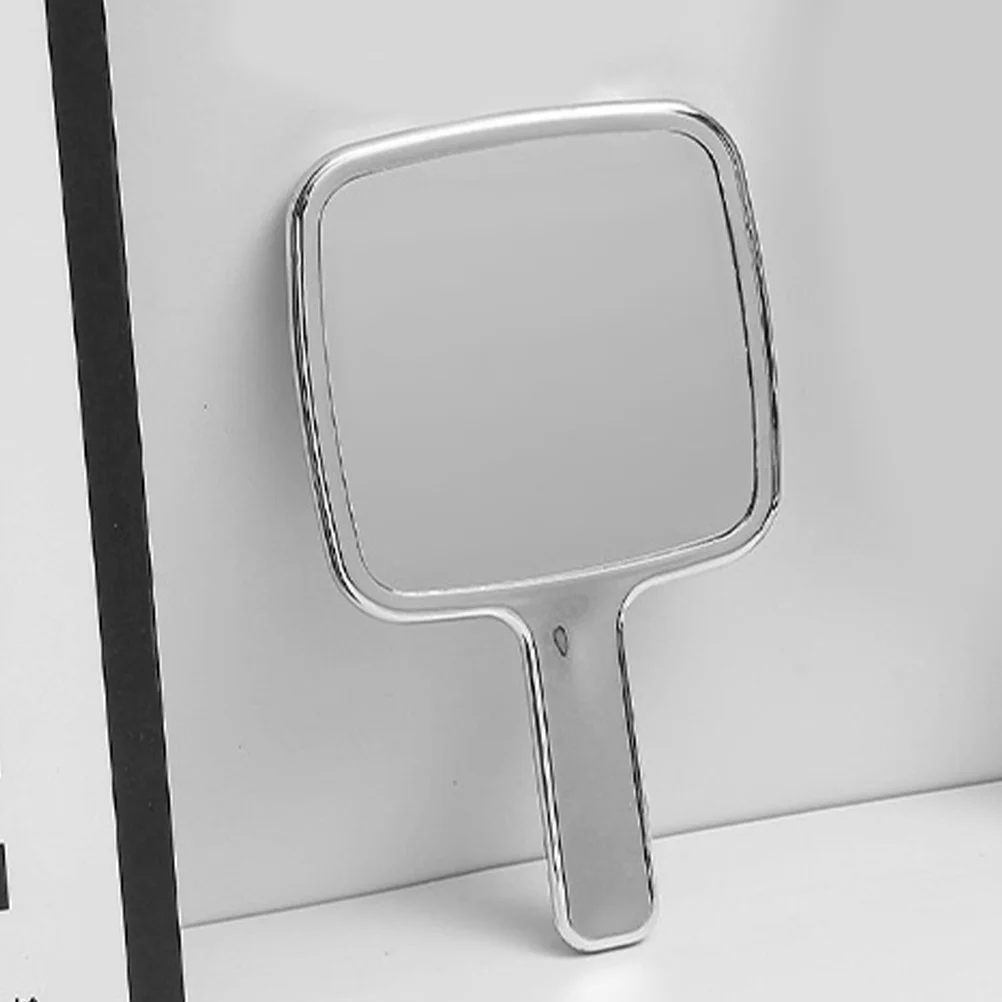 Espejo de maquillaje de mano Superficie reflectante portátil de alta definición Acabado galvanizado Accesorio elegante para mujeres Niñas Plata
