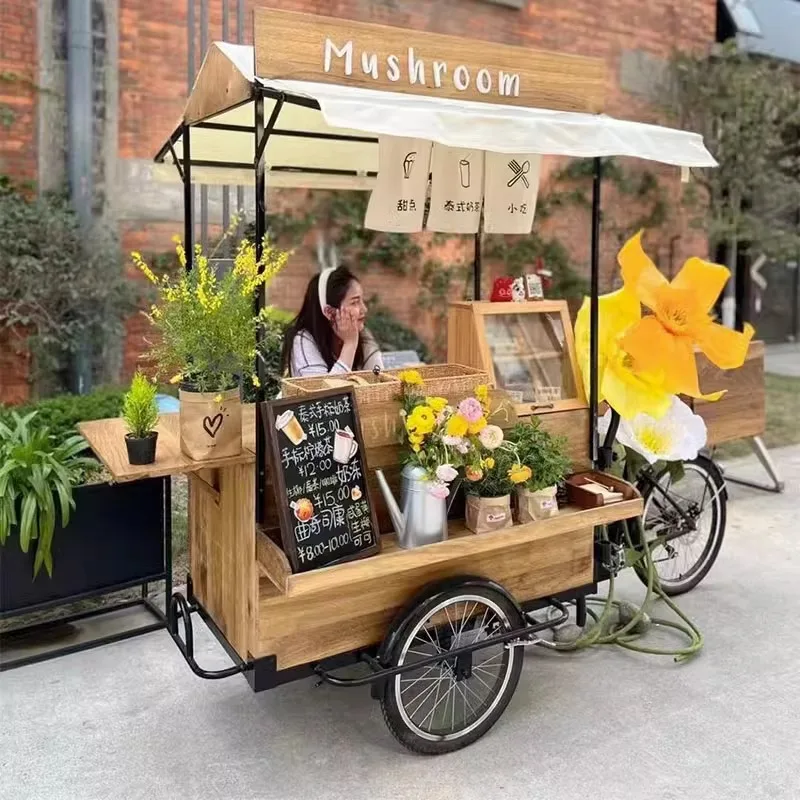 

American retro solid wood mobile reverse riding three-wheeled dining car, coffee bread promotion stall, night market scenic spot