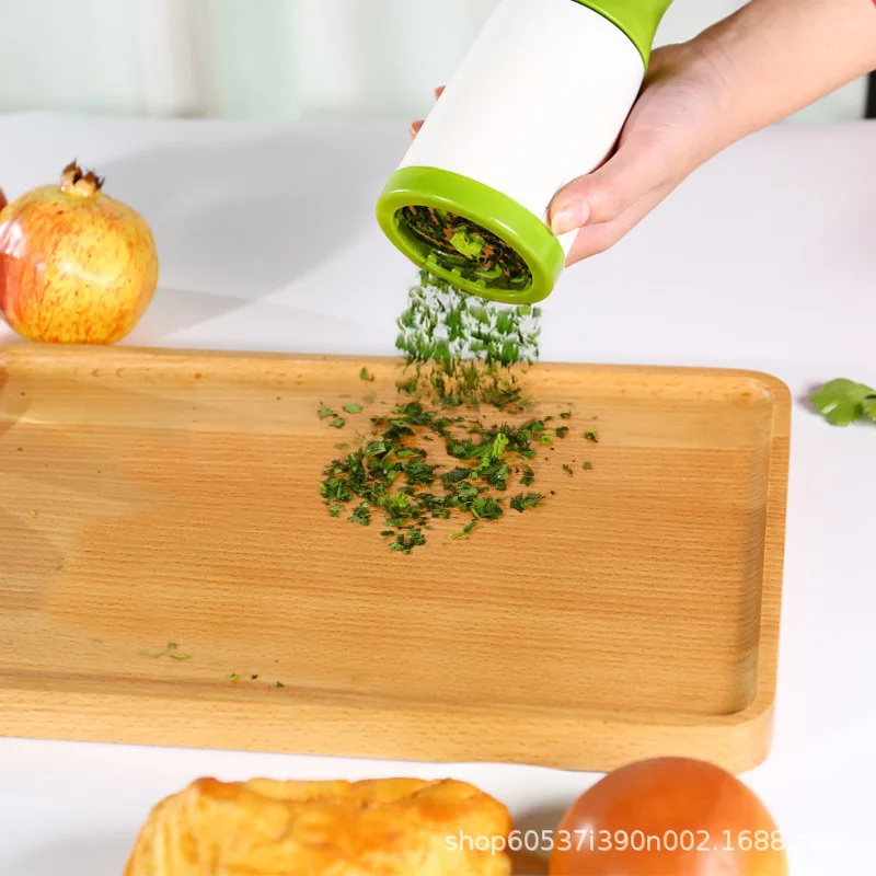 Kitchen multi-functional vegetable and herb grater, suitable for slicing and grinding vegetables, parsley, rosemary and more.