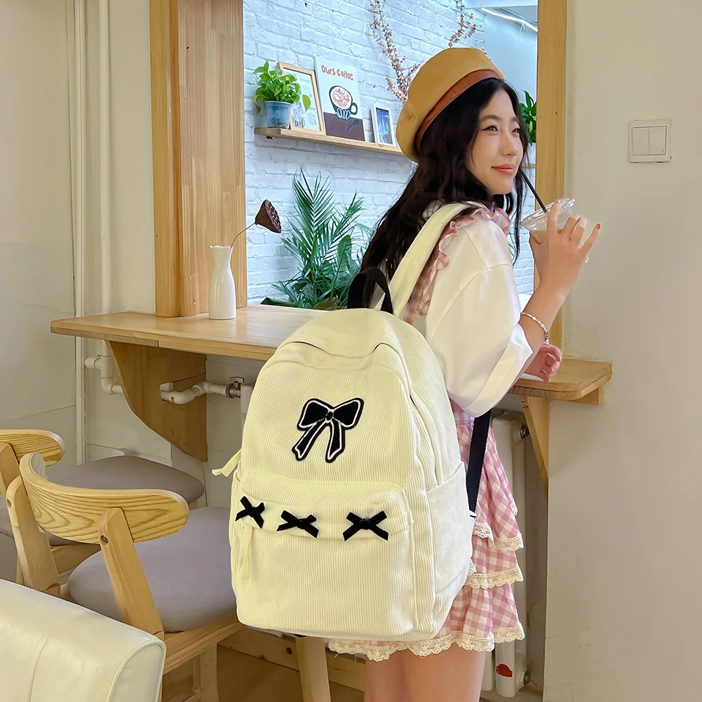 

Cute Bowknot Aesthetic Backpack Corduroy Casual Travel Daypack Lightweight School Bag for Girls Women High School College Work