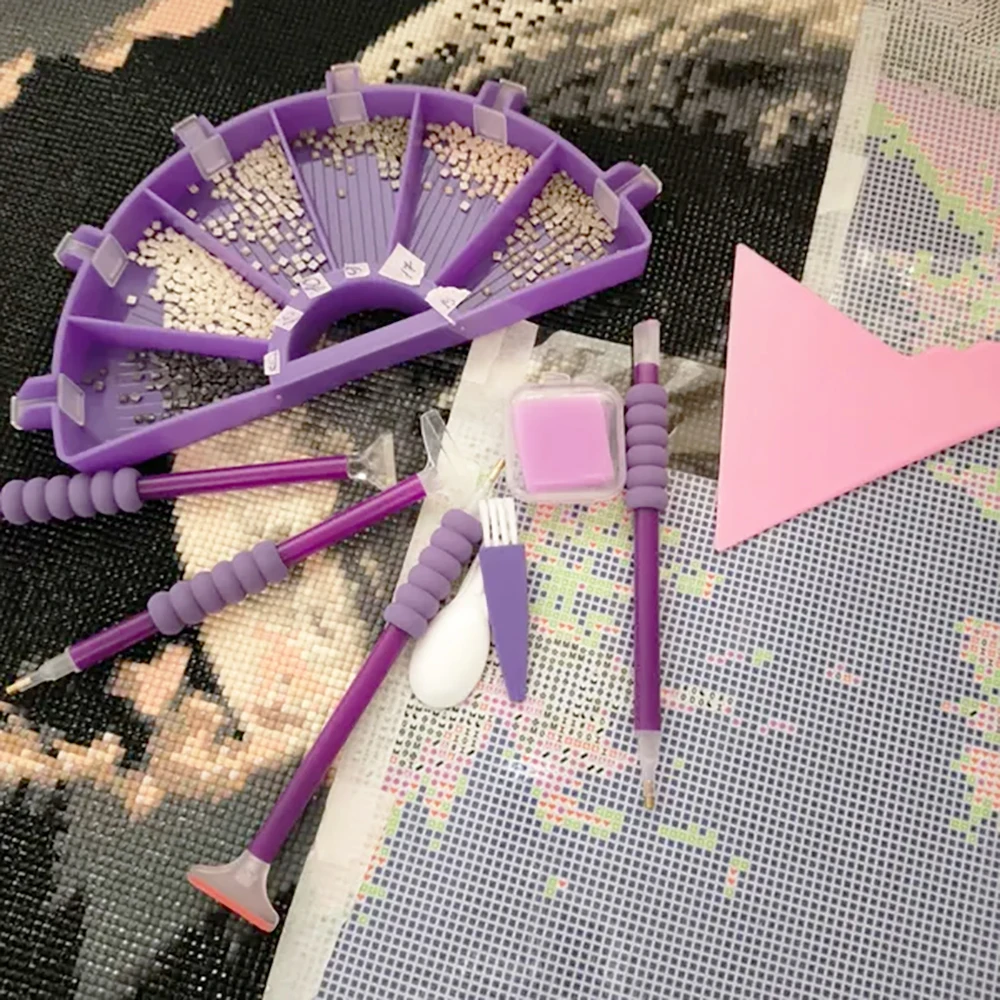 Diamond mosaic set, rhinestone tray, stylus, glue, shovel.
